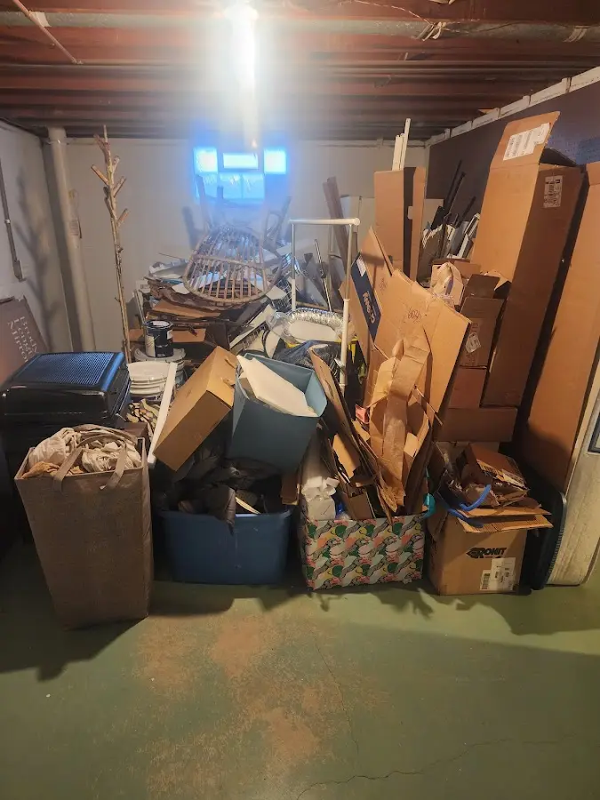 Roll-off dumpster container at job site for 4 Yard Dumpster Rental in Reynolds